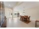 Open dining room with tiled floors, traditional furniture and modern lighting at 14421 Nonna Sky Drive Dr, Spring Hill, FL 34609