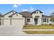 Charming single-Gathering home with a two-car garage and well-maintained lawn at 14421 Nonna Sky Drive Dr, Spring Hill, FL 34609
