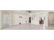 Expansive living room with tile flooring, recessed lighting, and seamless transitions to adjacent rooms at 14421 Nonna Sky Drive Dr, Spring Hill, FL 34609