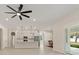 Bright open-concept living space with recessed lighting, ceiling fan, and access to the outdoors at 14421 Nonna Sky Drive Dr, Spring Hill, FL 34609