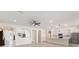 Bright, open-concept living space with recessed lighting and seamless flow to the kitchen at 14421 Nonna Sky Drive Dr, Spring Hill, FL 34609