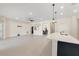 Spacious living space featuring recessed lighting, tile floors and an open concept floorplan at 14421 Nonna Sky Drive Dr, Spring Hill, FL 34609