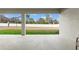 Covered patio overlooking a grass backyard and white fence at 14421 Nonna Sky Drive Dr, Spring Hill, FL 34609