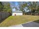 Large backyard with a storage shed and a fully fenced perimeter, offering ample outdoor space at 1709 W Dempsey Ave, Tampa, FL 33603