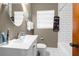Well-maintained bathroom features a sleek vanity, mirror, and a shower-tub combination at 1709 W Dempsey Ave, Tampa, FL 33603