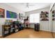 This bedroom features wood floors, and a large window for lots of natural light at 1709 W Dempsey Ave, Tampa, FL 33603
