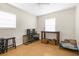 Bright bedroom space with wood flooring and windows for plenty of natural light at 1709 W Dempsey Ave, Tampa, FL 33603