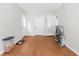 Open room with laminate flooring, offering versatility for a variety of uses at 1709 W Dempsey Ave, Tampa, FL 33603
