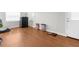 Open room with laminate flooring, offering versatility for a variety of uses at 1709 W Dempsey Ave, Tampa, FL 33603