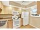 Bright kitchen with ample counter space, appliances, and warm wood cabinets, offering a practical cooking area at 3038 Eastland Blvd # F103, Clearwater, FL 33761