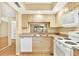 Bright kitchen with ample counter space, and warm wood cabinets, offering a practical cooking area at 3038 Eastland Blvd # F103, Clearwater, FL 33761