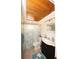 Charming bathroom with decorative shower curtain and vanity with cabinet storage at 3526 Overland Dr, Holiday, FL 34691