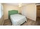 Bedroom featuring wood-look floors, a ceiling fan, neutral walls and a closet for storage at 3526 Overland Dr, Holiday, FL 34691
