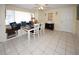 Dining area with tiled floors, seating, and decor at 3526 Overland Dr, Holiday, FL 34691