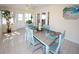 Bright dining area with a view of the outdoors, furnished with a four-chair dining set at 3526 Overland Dr, Holiday, FL 34691