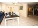 Dining area with tiled floors, seating, and decor at 3526 Overland Dr, Holiday, FL 34691
