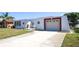 Unique exterior with distinctive architectural features, inviting curb appeal at 3526 Overland Dr, Holiday, FL 34691