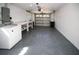 Spacious garage with room for parking and storage, complemented by a laundry area at 3526 Overland Dr, Holiday, FL 34691