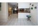 Bright kitchen with stainless steel appliances and tile flooring, perfect for cooking and entertaining at 3526 Overland Dr, Holiday, FL 34691