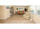 Bright living room featuring wood-look tile flooring, neutral walls, and comfortable seating area at 3526 Overland Dr, Holiday, FL 34691