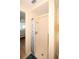 Shower featuring white tiled surround and a decorative shower curtain at 3526 Overland Dr, Holiday, FL 34691