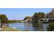 A scenic view of the lake behind these homes at 3526 Overland Dr, Holiday, FL 34691