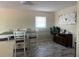 Dining room with a table and chairs, window, and stylish accent decor at 4115 Corn St, Port Charlotte, FL 33948