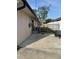 Property exterior featuring a fenced-in yard, concrete slab and ev charger at 4115 Corn St, Port Charlotte, FL 33948