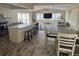 Open-concept living area flows from the kitchen featuring a large island to the comfortable living room at 4115 Corn St, Port Charlotte, FL 33948