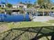Scenic view of the waterfront with a boat lift and dock at 4115 Corn St, Port Charlotte, FL 33948