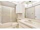 Bathroom features a large mirror, built in cabinets and a bathtub with a shower at 4620 Bay Blvd # 1154, Port Richey, FL 34668