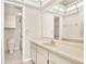 Well-lit bathroom features a vanity with storage space, a large mirror, and a walk-in shower at 4620 Bay Blvd # 1154, Port Richey, FL 34668
