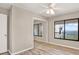 Comfortable bedroom with light vinyl flooring and a water view from the expansive window at 4620 Bay Blvd # 1154, Port Richey, FL 34668