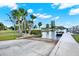 Community boat ramp leading to the waterway under a sunny blue sky at 4620 Bay Blvd # 1154, Port Richey, FL 34668