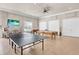 Large game room with ping pong table, billiards table, foosball table and TV for residents' enjoyment at 4620 Bay Blvd # 1154, Port Richey, FL 34668