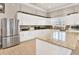 Bright kitchen featuring stainless steel appliances, granite countertops, and ample cabinet space at 4620 Bay Blvd # 1154, Port Richey, FL 34668