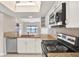 Modern kitchen featuring stainless appliances, granite counters, white cabinets and an eat-in area with water view at 4620 Bay Blvd # 1154, Port Richey, FL 34668