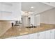 Updated kitchen featuring granite countertops, white cabinetry, modern appliances, and a cozy eat-in area at 4620 Bay Blvd # 1154, Port Richey, FL 34668