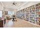 Community library featuring floor-to-ceiling bookshelves filled with books and seating at 4620 Bay Blvd # 1154, Port Richey, FL 34668