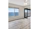 Bright living room boasts a ceiling fan, luxury vinyl floors, and an amazing water view at 4620 Bay Blvd # 1154, Port Richey, FL 34668