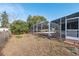 Spacious backyard featuring a screened-in pool area is ready for your enjoyment and personalization at 5155 Baldock Ave, Spring Hill, FL 34608