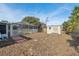 The backyard features a pool enclosure, utility shed, and is ready for new landscaping at 5155 Baldock Ave, Spring Hill, FL 34608