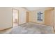 Bedroom with three doors and an attached bathroom and outdoor view at 5155 Baldock Ave, Spring Hill, FL 34608