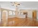 Spacious living area with hardwood floors, open to the kitchen and dining area at 5155 Baldock Ave, Spring Hill, FL 34608