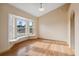 Cozy living area featuring natural light, wood-look flooring, and comfortable window seat at 5155 Baldock Ave, Spring Hill, FL 34608