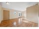 Bright room featuring high ceilings, wood-look flooring, and a unique round window at 5155 Baldock Ave, Spring Hill, FL 34608