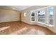 Bright living room featuring hardwood floors and a large bay window with a window seat at 5155 Baldock Ave, Spring Hill, FL 34608