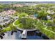 Aerial view showing the waterfront park including a playground, walking paths, and green space at 5640 Ferguson Ct # 2208, New Port Richey, FL 34652