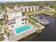Aerial view of waterfront condos with boat docks and a pool at 5640 Ferguson Ct # 2208, New Port Richey, FL 34652