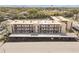 Aerial view showing the condo complex with covered parking, landscaping, and nearby waterways at 5640 Ferguson Ct # 2208, New Port Richey, FL 34652